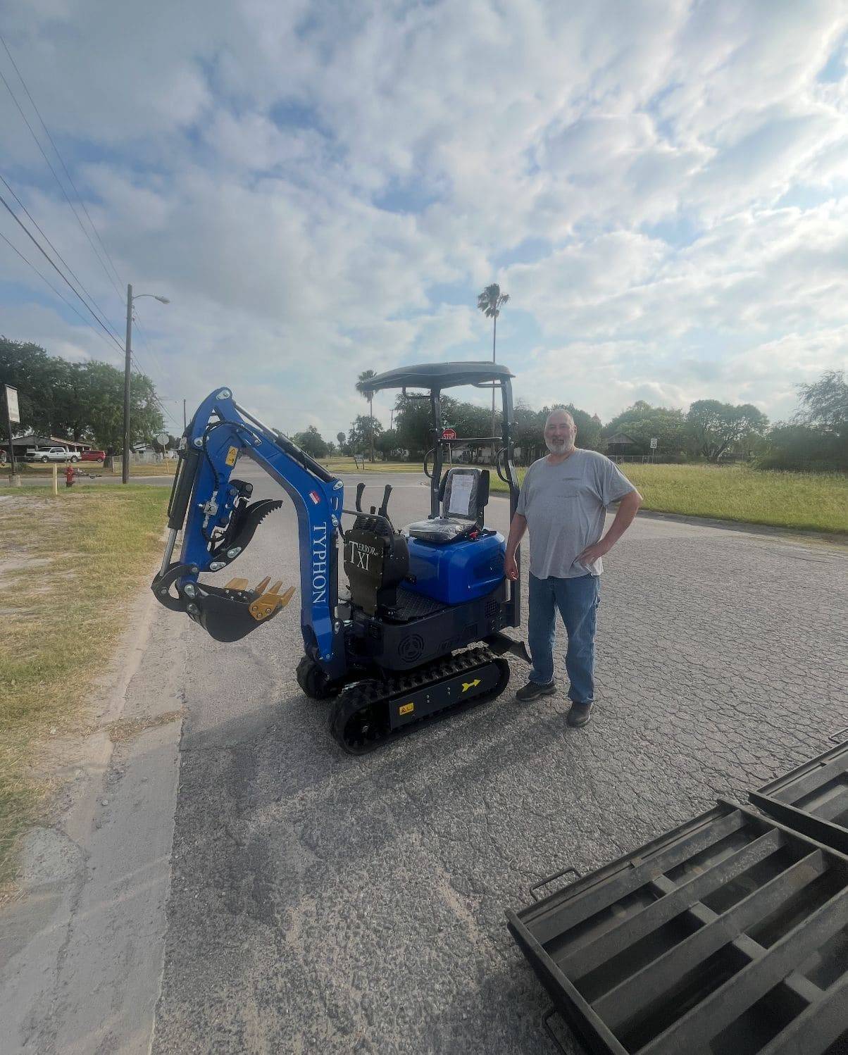 Damien Herndon with delivered compact equipment