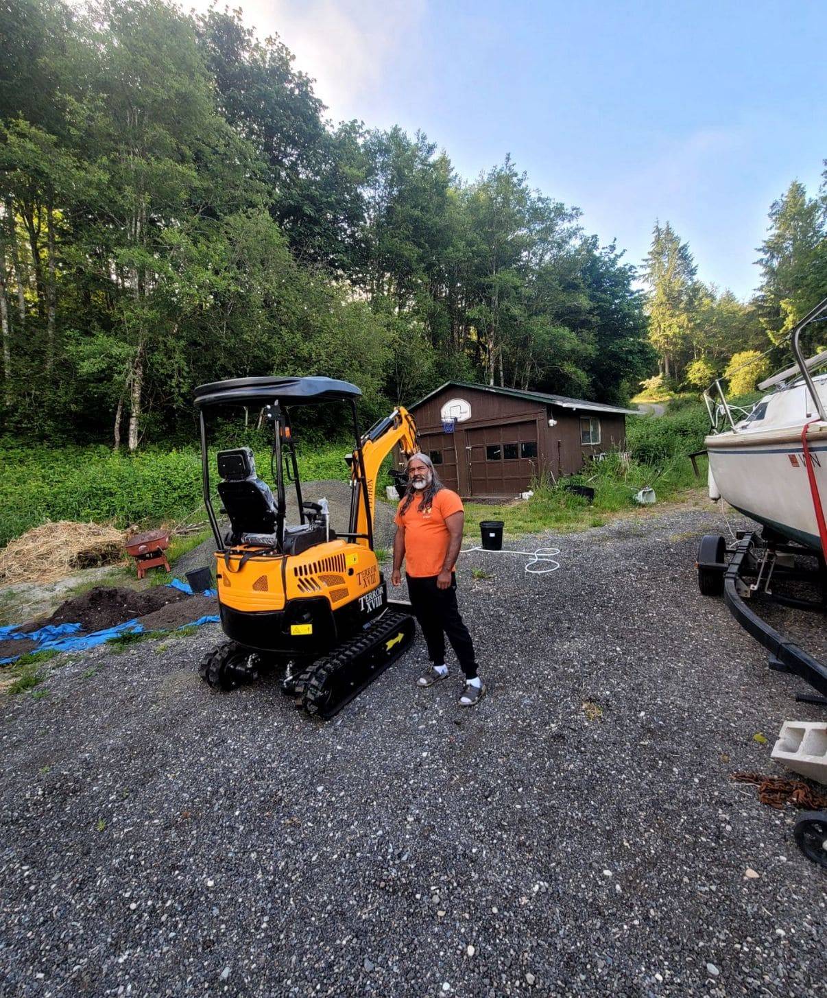David E. Thacker with delivered compact equipment