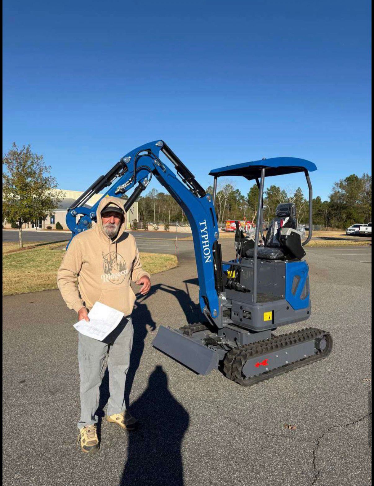 Ethan Harmon with delivered compact equipment